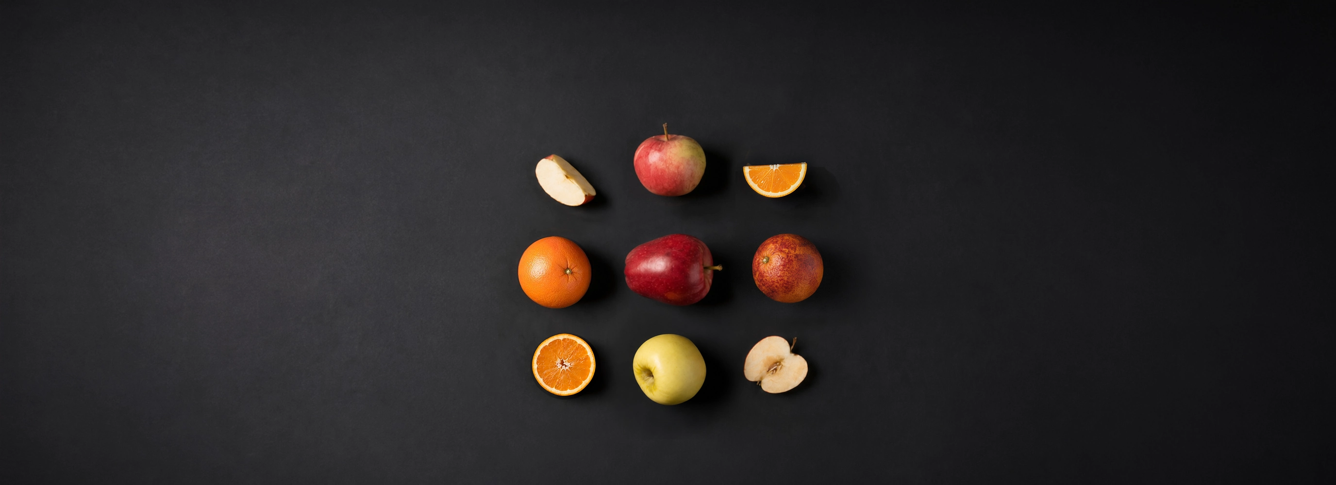 Apples and oranges arranged like the LBO logo